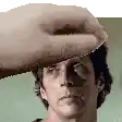 a close up of a man 's face with a hand covering his eyes .