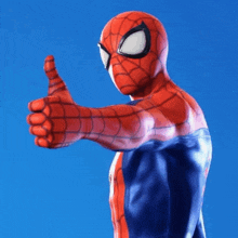 a close up of a spiderman giving a thumbs up sign