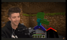 a man wearing headphones is playing a video game with a microphone in front of him
