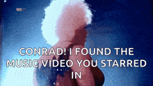 a woman with a tattoo on her back says " conrad i found the music video you starred in " .