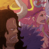 a man and a woman are standing next to each other and the woman is wearing a pink hat with an anchor on it