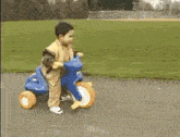 a little boy is playing on a playground slide .