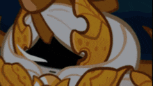 a close up of a cartoon character with a crown on his head .