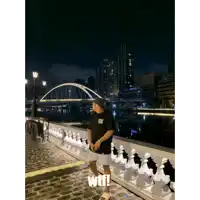 a man is standing on a bridge with the words wtf written on the bottom