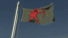 a flag with a red knight on it flies in the wind