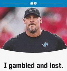 a man with a beard wearing a detroit lions hat and a black shirt