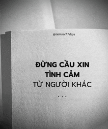 a black and white photo of a book with a quote on it