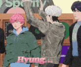 a group of young men are standing in front of a spotify sign