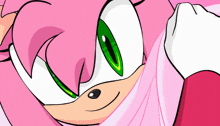 a pink cartoon character with green eyes