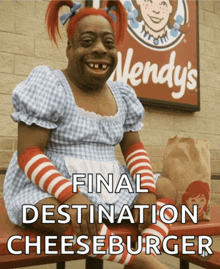 a wendy 's sign is behind a woman in a wendy 's costume
