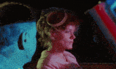 a woman with a veil on her head looks at a man in a car