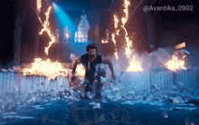 a man is running through a room full of flames with the hashtag avantika0902