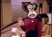 a man with a monkey mask on his head waving his hand