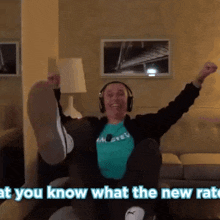 a man wearing headphones sitting on a couch with the words " at you know what the new rate "
