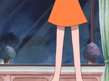 a girl in an orange skirt is standing on a window sill