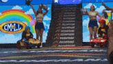 two cheerleaders are standing in front of a sign that says roshfrans