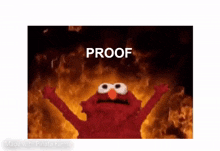 elmo is standing in front of a fire with his arms in the air and the words `` proof '' written on the bottom .
