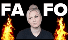 a woman stands in front of a fire with the words fa fo behind her
