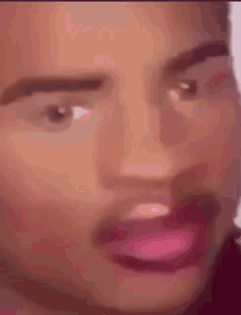 a close up of a person 's face with pink lipstick on .
