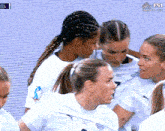 a group of female soccer players are huddled together on a screen that says fs1 group a live