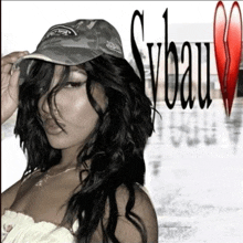 a woman wearing a camo hat is standing in front of a sign that says sveau