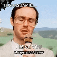 a man with glasses is holding a microphone and saying `` thanks jamie ... i love you always and forever ''
