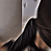 a blurry picture of a person 's torso with a white background