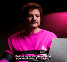 a man in a pink shirt with a heart rate monitor on his chest says but daddy is a state of mind