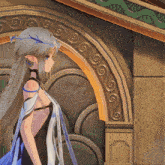 a girl with a crown on her head is standing in front of a wall with swirls on it