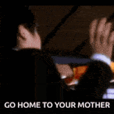 a woman in a yellow shirt is giving the middle finger and the words go home to your mother are below her