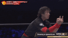 a man in a wrestling ring with the words streaming on njpwworld.com