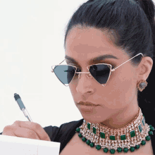 Taking Down Notes Lilly Singh GIF - Taking Down Notes Lilly Singh Murmuring GIFs