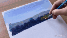 a person painting a landscape with orange and white