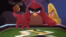 three angry birds are playing a game with dice