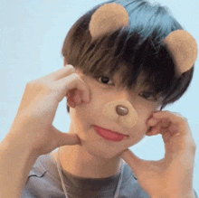 a young boy wearing a teddy bear mask makes a face