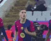 a soccer player wearing a jersey that says fcb on it