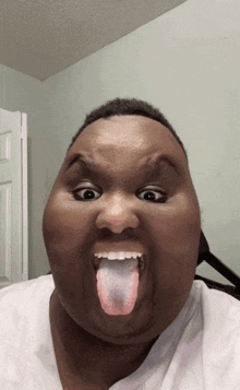a man is sticking his tongue out and making a funny face