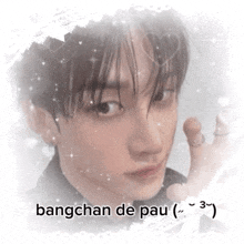 a picture of a young man with bangchan de pau written on the bottom