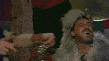 two men are laughing with their mouths open