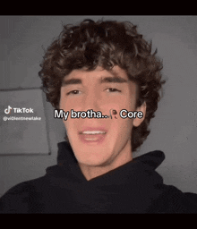 a young man with curly hair has a tiktok account