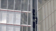 Protesters In London Climbs The Tallest Building GIF - Building London Protesters GIFs