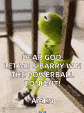 kermit the frog is sitting on a railing looking out a window and praying .
