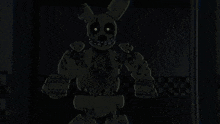 a dark room with a cartoon character and a blue box