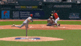 a baseball game is being played in front of an advertisement for bet365