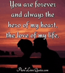 a couple kissing on a beach with a quote that says you are forever and always the hero of my heart the love of my life .