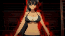 a woman in a bikini is standing in a dark room holding a sword in her hands .