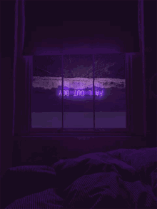 a dark room with a bed and a window with purple lights on