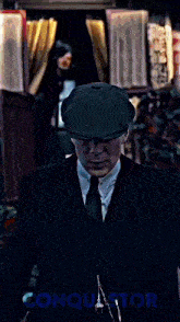a man in a tuxedo has the word conquest on the bottom