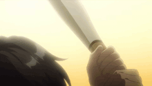 a close up of a person holding a knife in their hand .