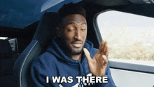 a man in a car with the words i was there written on the screen